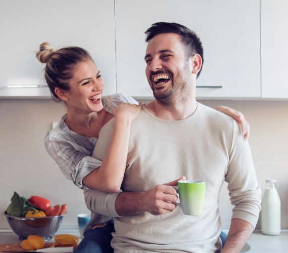 Couple (male and female) laughing