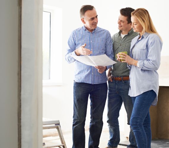 Couple being shown the building process of their home