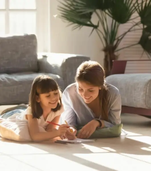 Mother and daughter drawing together