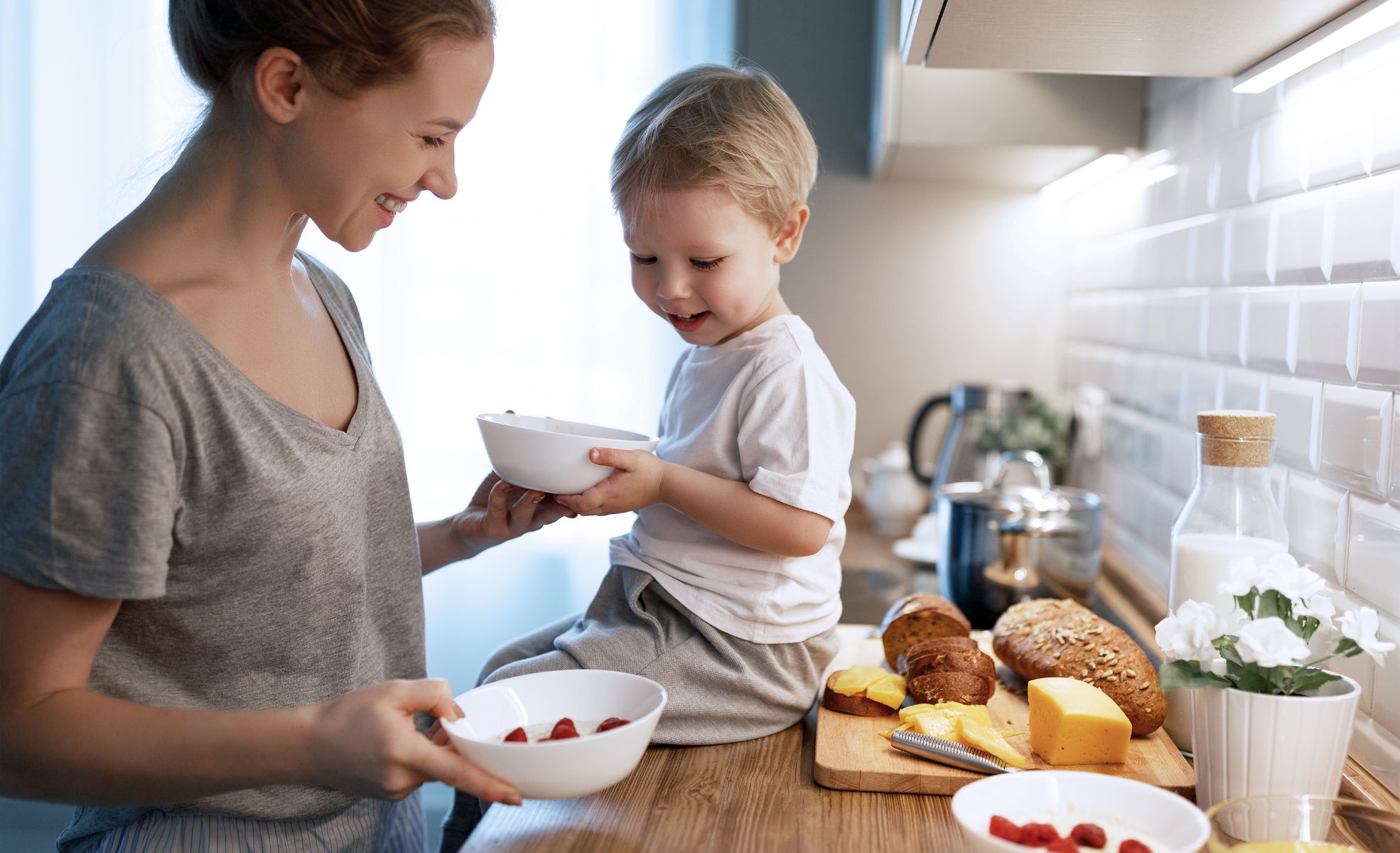 Mother in kitchen with son